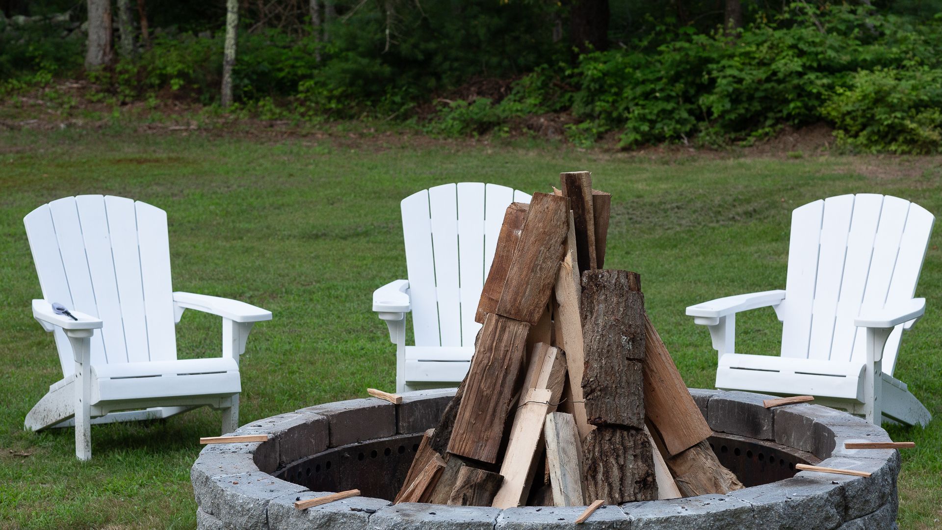 Fire pit and seating area on the lawn at the Old Arnold Estate