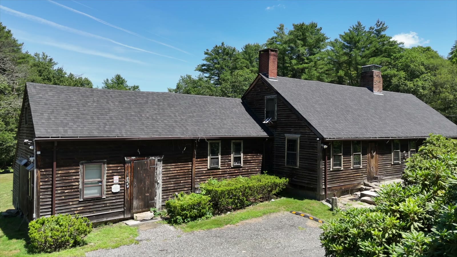 Exterior photo of the historic farmhouse known as The Conjuring House in Harrisville, Rhode Island