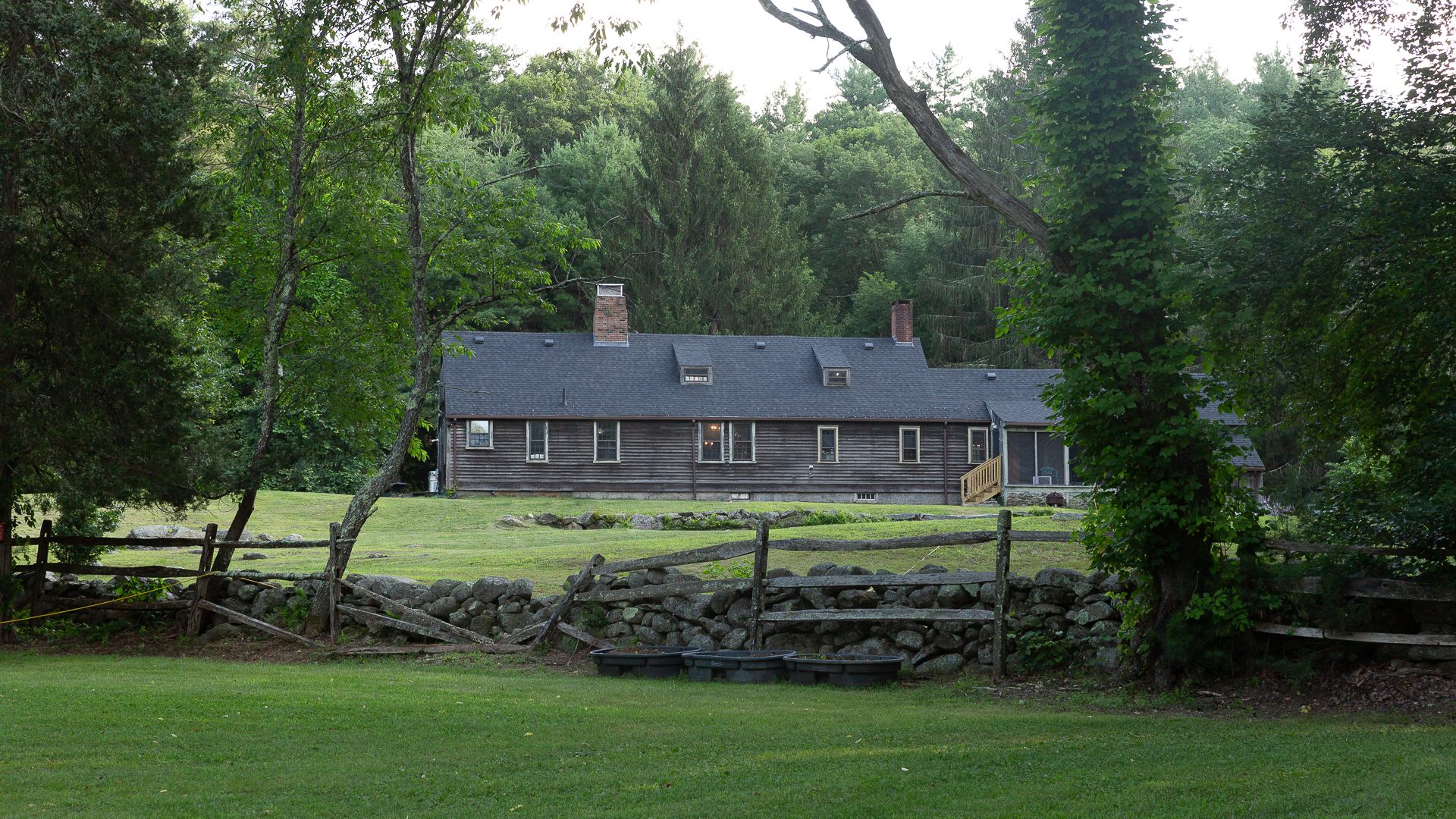 Landscape view of the farmhouse and grounds at the Old Arnold Estate